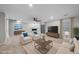 Staged living room showcasing a modern design with neutral furnishings and a large entertainment center at 7340 Doverton Ct, Raleigh, NC 27615