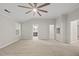 Empty main bedroom features neutral carpet, an ensuite bathroom, and a walk-in closet at 7340 Doverton Ct, Raleigh, NC 27615