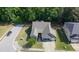 An aerial view showcasing the home's layout, well-maintained lawn, and proximity to surrounding neighborhood amenities at 7660 Channery Way, Raleigh, NC 27616