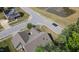 A serene aerial view showcasing the neighborhood and the house featuring a well-manicured lawn, and lush trees at 7660 Channery Way, Raleigh, NC 27616