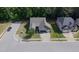 Aerial view showcasing a well-manicured lawn of this inviting single-Gathering home in a desirable neighborhood at 7660 Channery Way, Raleigh, NC 27616