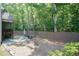 Spacious backyard featuring a patio, wooden fence, and ample green space at 7660 Channery Way, Raleigh, NC 27616