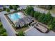 Aerial view showcasing the community pool and recreational area with a playground and ample space for relaxation at 7660 Channery Way, Raleigh, NC 27616