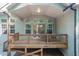 Outdoor deck features a covered ceiling and multiple windows providing a view of the backyard at 7660 Channery Way, Raleigh, NC 27616