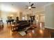 Expansive living room with hardwood floors open to the kitchen and dining areas at 7660 Channery Way, Raleigh, NC 27616