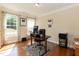 Bright office with hardwood floors, white trim, desk, and lots of natural light at 7660 Channery Way, Raleigh, NC 27616