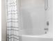 Bathtub shower combination featuring chrome faucet and shower head and neutral shower curtain at 7761 Winners Edge St, Raleigh, NC 27617