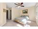 Bright bedroom featuring carpet, neutral walls, ceiling fan, and natural light at 7761 Winners Edge St, Raleigh, NC 27617
