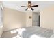 Comfortable bedroom with neutral walls, plush carpeting and ceiling fan with light fixture at 7761 Winners Edge St, Raleigh, NC 27617