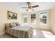 Inviting bedroom with a ceiling fan, natural light, and calming paint color at 7761 Winners Edge St, Raleigh, NC 27617