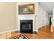 Elegant fireplace with detailed molding and dark hearth, adding a touch of sophistication to the room at 7761 Winners Edge St, Raleigh, NC 27617