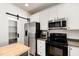 Bright kitchen featuring stainless steel appliances and white cabinetry at 7761 Winners Edge St, Raleigh, NC 27617