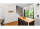 Kitchen island with butcher block countertop and view of staircase and sliding door at 7761 Winners Edge St, Raleigh, NC 27617