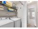Functional laundry room with washer, dryer, and shelving for storage at 7761 Winners Edge St, Raleigh, NC 27617