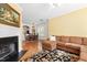 Inviting living room that blends seamlessly with a dining area, complete with a fireplace and plush sectional sofa at 7761 Winners Edge St, Raleigh, NC 27617