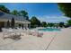 View of community pool with lounge chairs and tables on concrete surface at 7761 Winners Edge St, Raleigh, NC 27617