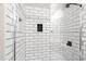 Modern shower stall featuring white subway tile and matte black fixtures at 7761 Winners Edge St, Raleigh, NC 27617