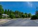 Well-maintained community streets showcase lush landscaping, mature trees, and the clubhouse at 7761 Winners Edge St, Raleigh, NC 27617