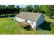 Aerial shot showcasing the back of a house with a wooden deck and a large fenced yard at 78 Cross Creek Ct, Timberlake, NC 27583