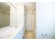 Bright bathroom featuring a double sink vanity with ample storage, a mirror, and a bathtub at 78 Cross Creek Ct, Timberlake, NC 27583