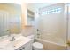 Clean bathroom featuring a sink, toilet, mirror, storage cabinet, and a shower-tub combination at 78 Cross Creek Ct, Timberlake, NC 27583