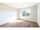 Cozy bedroom with natural light, carpet, a large window offering outdoor views at 78 Cross Creek Ct, Timberlake, NC 27583