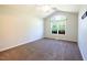 Spacious bedroom featuring neutral walls, carpeted floor, ceiling fan, and a large window at 78 Cross Creek Ct, Timberlake, NC 27583