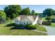 Inviting single-Gathering home with manicured lawn, mature trees, and long gravel driveway at 78 Cross Creek Ct, Timberlake, NC 27583