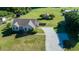 Charming home featuring a long driveway, lush lawn, and mature trees in a peaceful residential setting at 78 Cross Creek Ct, Timberlake, NC 27583