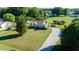 Charming single-Gathering home with a well-manicured lawn and a long gravel driveway in a residential area at 78 Cross Creek Ct, Timberlake, NC 27583