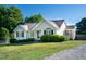 Charming one-story home featuring a well-maintained lawn and manicured landscaping at 78 Cross Creek Ct, Timberlake, NC 27583