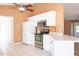 Kitchen with stainless steel oven, microwave, and neutral-toned tile backsplash at 78 Cross Creek Ct, Timberlake, NC 27583