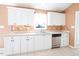 Updated kitchen with stainless steel dishwasher, neutral countertops, and tile flooring at 78 Cross Creek Ct, Timberlake, NC 27583