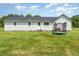 Spacious backyard featuring a trampoline and ample green space at 80 Lewis Moody Rd, Bear Creek, NC 27207