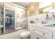 Bathroom featuring shower, toilet, sink, vanity, and mirrored wall at 80 Lewis Moody Rd, Bear Creek, NC 27207