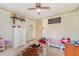 Bedroom with hardwood-styled paneled walls and modern -themed decor at 80 Lewis Moody Rd, Bear Creek, NC 27207