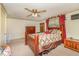 Cozy bedroom featuring a ceiling fan, dresser, and ornate wooden furniture at 80 Lewis Moody Rd, Bear Creek, NC 27207