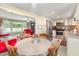 An open layout with eat-in kitchen featuring stainless steel appliances and seamless access to the living room at 80 Lewis Moody Rd, Bear Creek, NC 27207