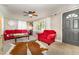 Bright and cozy living room featuring a ceiling fan, natural light and warm, inviting decor at 80 Lewis Moody Rd, Bear Creek, NC 27207
