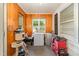 Utility room with a deep freezer, water heater, and windows at 80 Lewis Moody Rd, Bear Creek, NC 27207