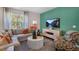 Cozy living room with comfortable seating, natural light, and modern decor at 808 Bullhorn Dr, Wake Forest, NC 27587
