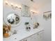 Stylish bathroom featuring a double sink vanity with decorative mirrors and modern lighting fixtures at 808 Trinity Park Dr, Wake Forest, NC 27587