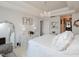 Serene bedroom with white linens, decorative chandelier, and an elegant dressing table at 808 Trinity Park Dr, Wake Forest, NC 27587
