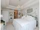 Bright bedroom with a canopy bed, a decorative chandelier, and elegant decor at 808 Trinity Park Dr, Wake Forest, NC 27587