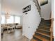 Stylish staircase and an open view into the light and airy living room at 808 Trinity Park Dr, Wake Forest, NC 27587