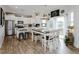 Bright, open kitchen featuring white cabinets, stainless appliances, and a butcher block island with seating at 808 Trinity Park Dr, Wake Forest, NC 27587
