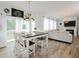Open-concept living and dining area with hardwood floors and modern decor with plenty of natural light at 808 Trinity Park Dr, Wake Forest, NC 27587