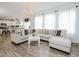 Bright living room with a comfortable sectional sofa and an open view into the kitchen at 808 Trinity Park Dr, Wake Forest, NC 27587