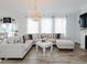 Spacious living room featuring a fireplace, large windows, and comfortable seating at 808 Trinity Park Dr, Wake Forest, NC 27587