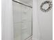 Modern shower with glass doors and white interior at 808 Trinity Park Dr, Wake Forest, NC 27587